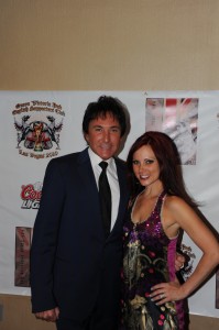 GREG LONDON and Tarrah Williams-Leon of the new production, “Greg’s London’s ICONS” on the Red Carpet for the Grand Opening of the Queen Victoria Pub at The Riviera in Las Vegas on June 28.
