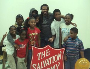 Singer-songwriter Sharif Iman (middle) pictured with participants at Nashville's Salvation Army facility.