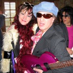 PHOTO CAPTION:  Daisy Rock Girl Guitars President Tish Ciravolo  presents  Sylvain Sylvain of The New York Dolls  with an Atomic Pink Rock Candy guitar at SXSW 2005 during the 20th anniversary SPIN Magazine party at the legendary Stubb's BBQ in Austin, Texas.
