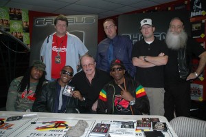 Pictured at an in-store appearance at Las Vegas' Zia Record Exchange (seated) left to right, Dewey Cooper, President/CEO Head Trauma Records; Canibus, Morey Alexander, President/CEO Kent Entertainment; Phoenix Orion, (standing), left to right, Karl Hartwig, Manager Las Vegas Operations, Zia Record Exchange; Chris Madsen, AE Hot 97.5 radio; Zak Frankel, Zia Records; and Tristan “Doc” Dubois, Director of Business Development, Kent Entertainment.