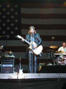 Billy Ray Cyrus performs in front of Old Glory at the San Diego County Fair in Del Mar, CA.