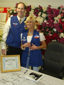 Pictured Left To Right: Wal-Mart Manager Roger Johnson and Lorrie Morgan