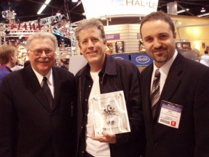 PHOTO CAPTION: (L-R) Keith Mardak, Keith Wyatt, Jeff Schroedl - Hal Leonard Chairman and CEO Keith Mardak and Vice President, Pop & Standard Publications Jeff Schroedl present anniversary plaque to Musicians Institute Director of Programs Keith Wyatt at 2007 Winter NAMM show