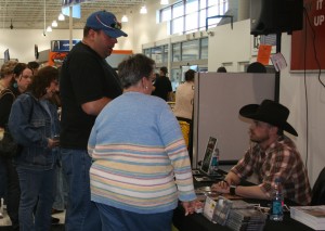 PHOTO CAPTION:  Minneapolis-based rising country star Shane Wyatt signing autographs for fans at the Best Buy in Maple Grove, MN 3/21/09