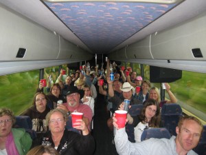 PHOTO CAPTION: Minnesota country music fans enjoying free drinks onboard the “Shane Train” en route to the Surf Ballroom in Clear Lake, IA.