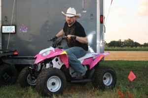 PHOTO CAPTION: Minneapolis Country music favorite Shane Wyatt showing his tough but feminine side at Outlaw Grass Drag in Princeton, MN.
