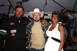 PHOTO CAPTION: Minneapolis-based rising Country star Shane Wyatt with newlyweds Gary and Leann Beardslee during their wedding reception on September 9th, which was taped for an episode of CMT’s  upcoming series “My Big Redneck Wedding”, hosted by Tom Arnold.